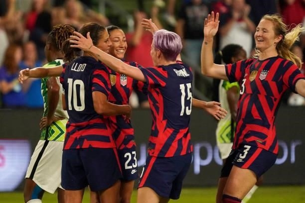 Christen Press of the United States is congratulated by teammates Carli Lloyd, Megan Rapinoe and Samantha Mewis after scoring a goal against Nigeria...