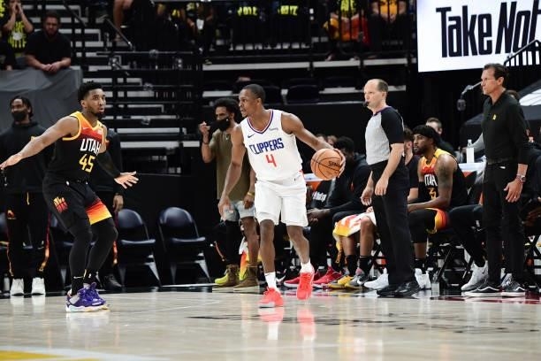 Rajon Rondo of the LA Clippers handles the ball as Donovan Mitchell of the Utah Jazz plays defense during the game during Round 2, Game 5 of the 2021...