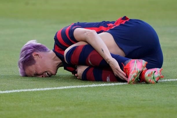 Megan Rapinoe of the United States grabs her ankle in pain during the first half of their WNT Summer Series game against Nigeria at Q2 Stadium on...