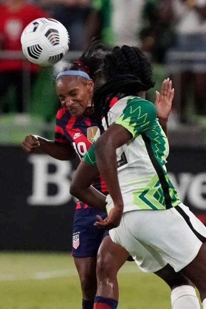 Crystal Dunn of the United States heads the ball against Michelle Alozie of Nigeria during the first half of their WNT Summer Series game at Q2...