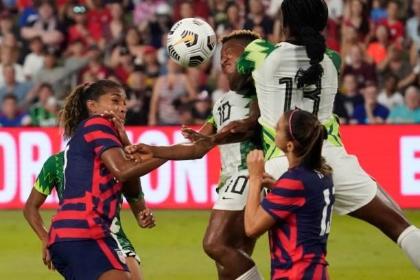 Rita Chikwelu of Nigeria competes for the ball against Catarina Macario of the United States during the second half of their WNT Summer Series game...