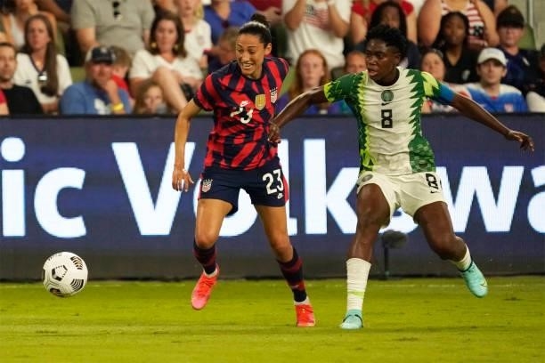 Christen Press of the United States controls the ball against Asisat Oshoala of Nigeria during the first half of their WNT Summer Series game at Q2...