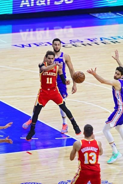 Trae Young of the Atlanta Hawks passes the ball to Bogdan Bogdanovic of the Atlanta Hawks against the Philadelphia 76ers in game 5 of the conference...