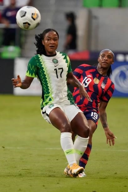 Crystal Dunn of the United States kicks the ball against Francisca Ordega of Nigeria during the first half of their WNT Summer Series game at Q2...