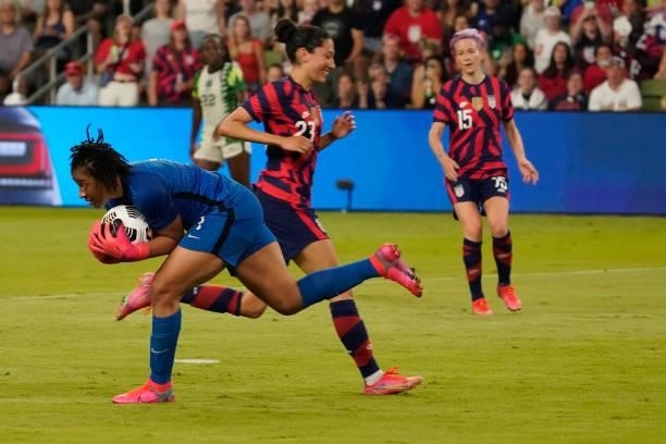 Goalkeeper Tochukwu Oluehi of Nigeria makes a save against Christen Press of the United States during the second half of their WNT Summer Series game...