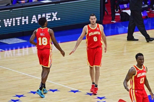 Solomon Hill of the Atlanta Hawks high fives Danilo Gallinari of the Atlanta Hawks during the game against the Philadelphia 76ers in game 5 of the...