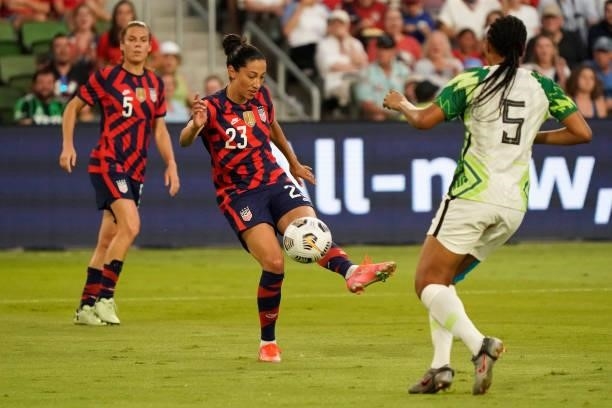Christen Press of the United States shoots against Onome Ebi of Nigeria during the first half of their WNT Summer Series game at Q2 Stadium on June...