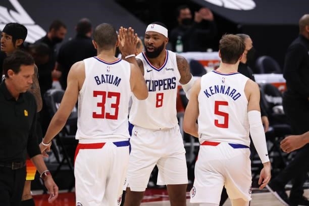 Marcus Morris Sr. #8 of the LA Clippers high-fives teammates during the game against the Utah Jazz during Round 2, Game 5 of the 2021 NBA Playoffs on...