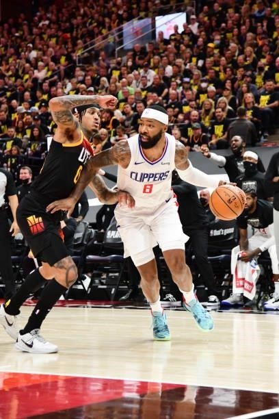 Marcus Morris Sr. #8 of the LA Clippers handles the ball as Jordan Clarkson of the Utah Jazz plays defense during the game during Round 2, Game 5 of...