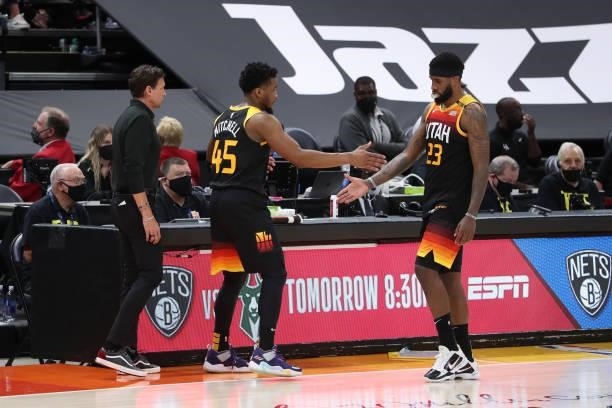 Royce O'Neale of the Utah Jazz high-fives teammate Donovan Mitchell during the game against the LA Clippers during Round 2, Game 5 of the 2021 NBA...