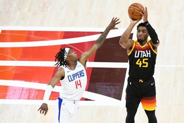 Donovan Mitchell of the Utah Jazz shots over Terance Mann of the LA Clippers in Game Five of the Western Conference second-round playoff series at...