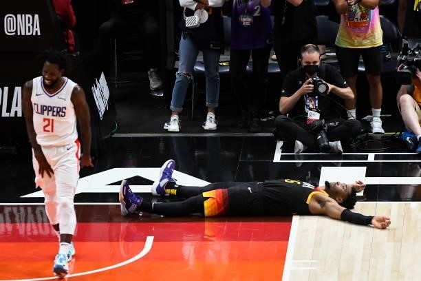 Donovan Mitchell of the Utah Jazz lies on the ground after being fouled by Patrick Beverley of the LA Clippers in Game Five of the Western Conference...