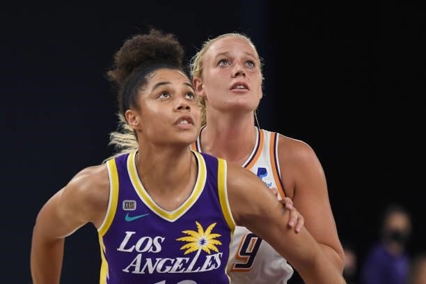 Nia Coffey of the Los Angeles Sparks and Sophie Cunningham of the Phoenix Mercury look up during their game on June 16, 2021 at Los Angeles...