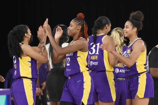 The Los Angeles Sparks high five during the game against the Phoenix Mercury on June 16, 2021 at Los Angeles Convention Center in Los Angeles,...