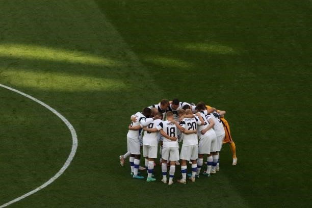 Team Finland hug prior to the kick-off of the UEFA Euro 2020 Championship Group B match between Finland and Russia at Saint Petersburg Stadium on...