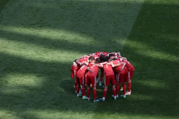 Team Russia hug prior to the kick-off of the UEFA Euro 2020 Championship Group B match between Finland and Russia at Saint Petersburg Stadium on June...