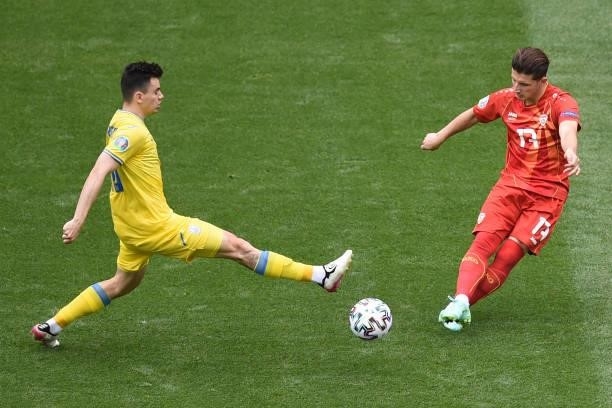 Ukraine's midfielder Mykola Shaparenko fights for the ball with North Macedonia's midfielder Enis Bardhi during the UEFA EURO 2020 Group C football...