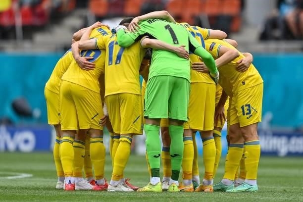 Ukraine's players huddle before the UEFA EURO 2020 Group C football match between Ukraine and North Macedonia at the National Arena in Bucharest on...