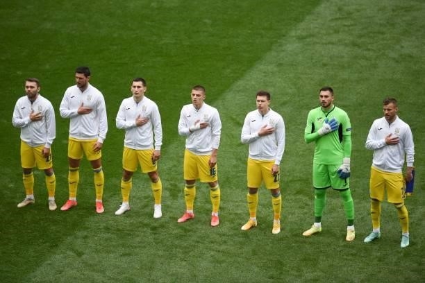 Ukraine's players stand for their national anthem prior to the UEFA EURO 2020 Group C football match between Ukraine and North Macedonia at the...