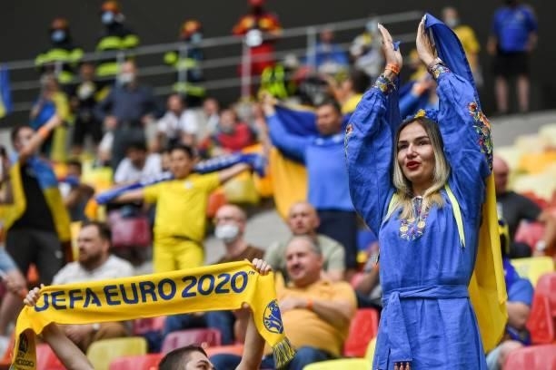Ukraine supporters cheer before the UEFA EURO 2020 Group C football match between Ukraine and North Macedonia at the National Arena in Bucharest on...