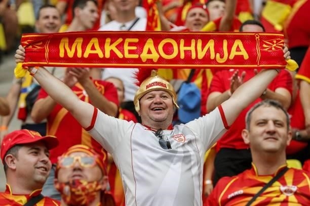 North Macedonia supporter holds a scarf before the UEFA EURO 2020 Group C football match between Ukraine and North Macedonia at the National Arena in...