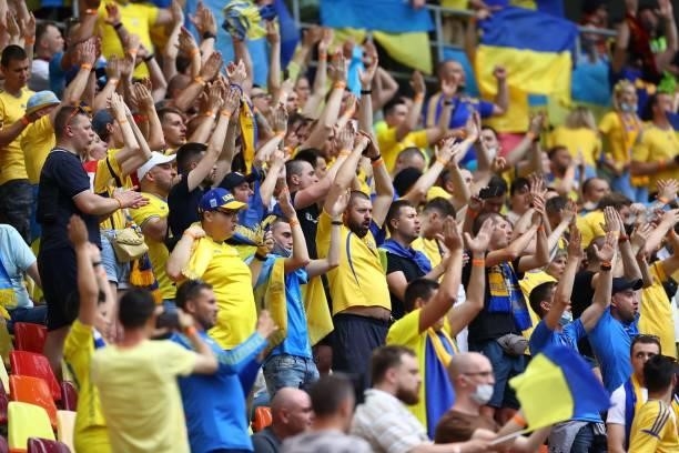 Ukraine supporters cheer before the UEFA EURO 2020 Group C football match between Ukraine and North Macedonia at the National Arena in Bucharest on...