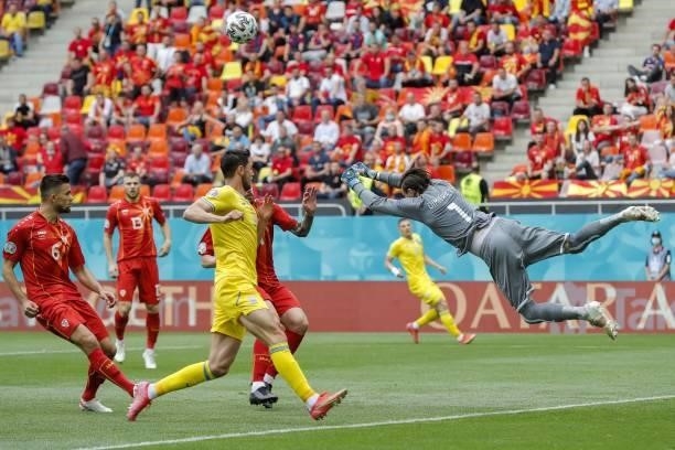 North Macedonia's goalkeeper Stole Dimitrievski punches the ball during the UEFA EURO 2020 Group C football match between Ukraine and North Macedonia...