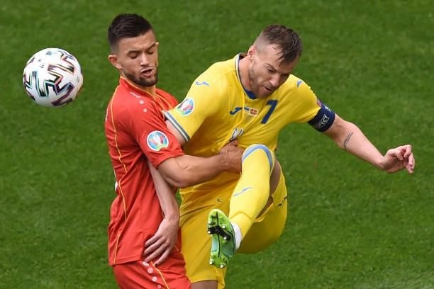North Macedonia's defender Visar Musliu fights for the ball with Ukraine's forward Andriy Yarmolenko during the UEFA EURO 2020 Group C football match...