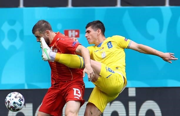 North Macedonia's defender Stefan Ristovski fights for the ball with Ukraine's midfielder Ruslan Malinovskyi during the UEFA EURO 2020 Group C...