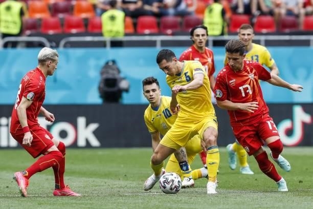 Ukraine's midfielder Taras Stepanenko fights for the ball with North Macedonia's midfielder Enis Bardhi during the UEFA EURO 2020 Group C football...