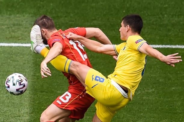 North Macedonia's defender Stefan Ristovski fights for the ball with Ukraine's midfielder Ruslan Malinovskyi during the UEFA EURO 2020 Group C...