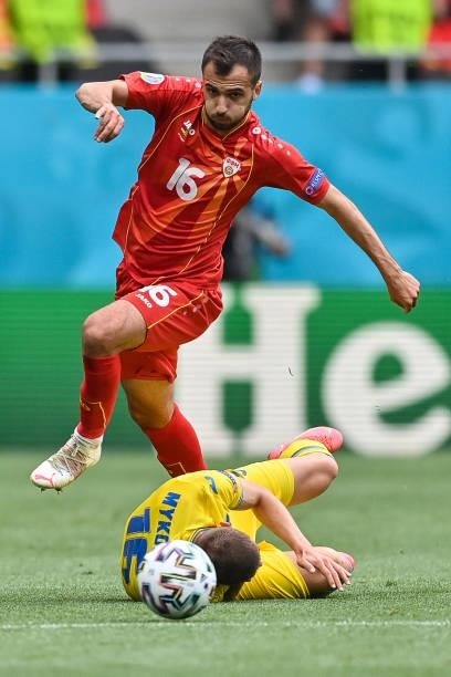 North Macedonia's midfielder Boban Nikolov fights for the ball with Ukraine's defender Vitaliy Mykolenko during the UEFA EURO 2020 Group C football...