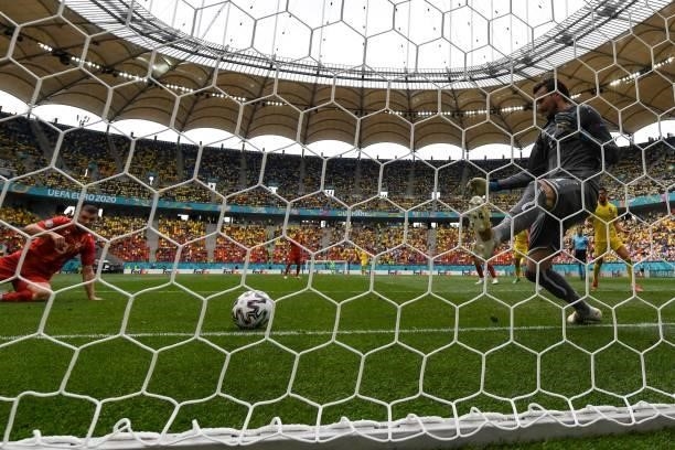 North Macedonia's goalkeeper Stole Dimitrievski concedes the opening goal during the UEFA EURO 2020 Group C football match between Ukraine and North...