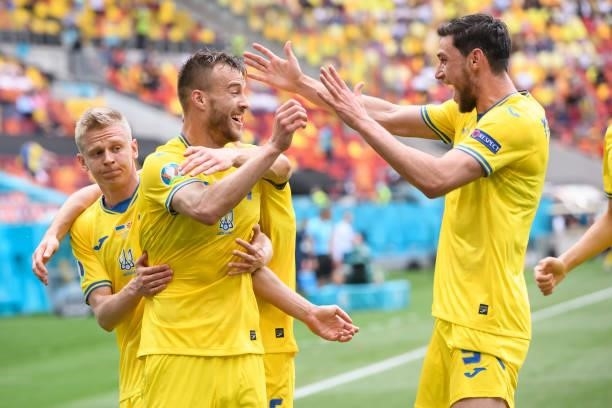 Andriy Yarmolenko of Ukraine celebrates after scoring his team's first goal with teammates during the UEFA Euro 2020 Championship Group C match...
