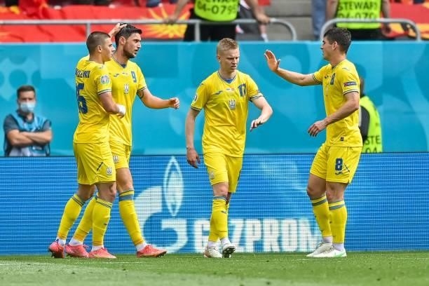 Ukraine's forward Roman Yaremchuk celebrates with teammates after scoring his team's second goal during the UEFA EURO 2020 Group C football match...