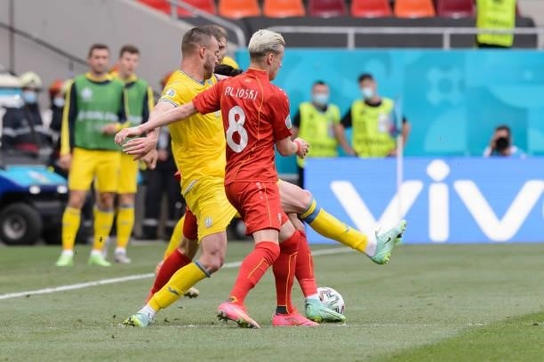 Andriy Yarmolenko of Ukraine and Egzjan Alioski of North Macedonia battle for the ball during the UEFA Euro 2020 Championship Group C match between...