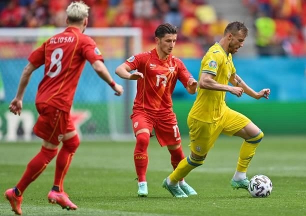 Ukraine's forward Andriy Yarmolenko fights for the ball with North Macedonia's midfielder Enis Bardhi during the UEFA EURO 2020 Group C football...