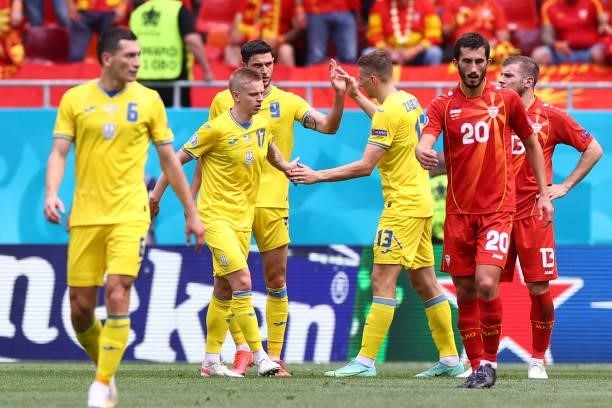 Ukraine's forward Roman Yaremchuk celebrates with teammates after scoring his team's second goal during the UEFA EURO 2020 Group C football match...