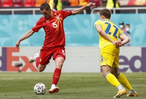 North Macedonia's midfielder Arijan Ademi fights for the ball with Ukraine's defender Mykola Matviyenko during the UEFA EURO 2020 Group C football...