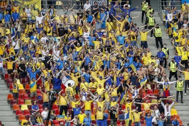 Ukraine supporters cheer during the UEFA EURO 2020 Group C football match between Ukraine and North Macedonia at the National Arena in Bucharest on...