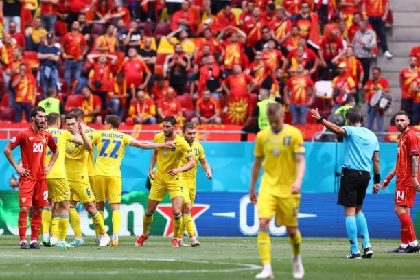 Ukraine's players celebrate their second goal during the UEFA EURO 2020 Group C football match between Ukraine and North Macedonia at the National...