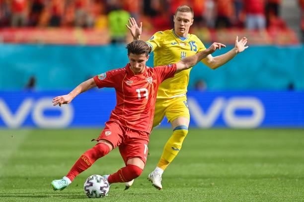 North Macedonia's midfielder Enis Bardhi fights for the ball with Ukraine's midfielder Viktor Tsygankov during the UEFA EURO 2020 Group C football...