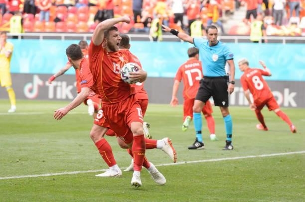 Stefan Ristovski of North Macedonia celebrates after scoring his team's first goal with teammates during the UEFA Euro 2020 Championship Group C...
