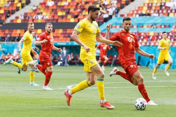 Roman Yaremchuk of Ukraine and Visar Musliu of North Macedonia battle for the ball during the UEFA Euro 2020 Championship Group C match between...