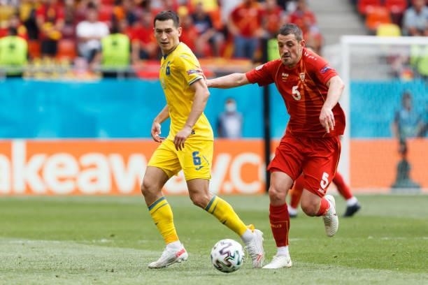 Taras Stepanenko of Ukraine and Arijan Ademi of North Macedonia battle for the ball during the UEFA Euro 2020 Championship Group C match between...