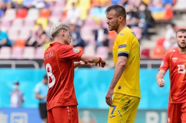 Egzjan Alioski of North Macedonia and Roman Yaremchuk of Ukraine speak during the UEFA Euro 2020 Championship Group C match between Ukraine and North...