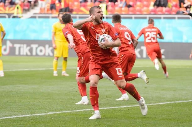Stefan Ristovski of North Macedonia celebrates after scoring his team's first goal with teammates during the UEFA Euro 2020 Championship Group C...