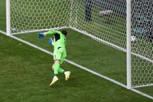 Ukraine's goalkeeper Georgiy Bushchan dives and concedes North Macedonia's first goal during the UEFA EURO 2020 Group C football match between...