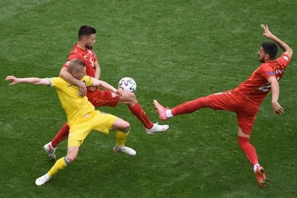 Ukraine's defender Oleksandr Zinchenko fights for the ball with North Macedonia's defender Visar Musliu during the UEFA EURO 2020 Group C football...