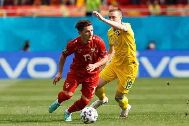 Enis Bardi of North Macedonia and Oleksandr Zubkov of Ukraine battle for the ball during the UEFA Euro 2020 Championship Group C match between...